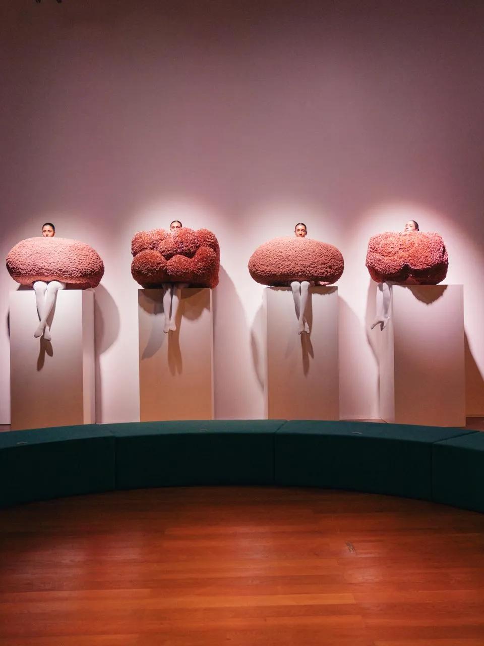 The element of theatricality was heightened with models sitting still through the show.