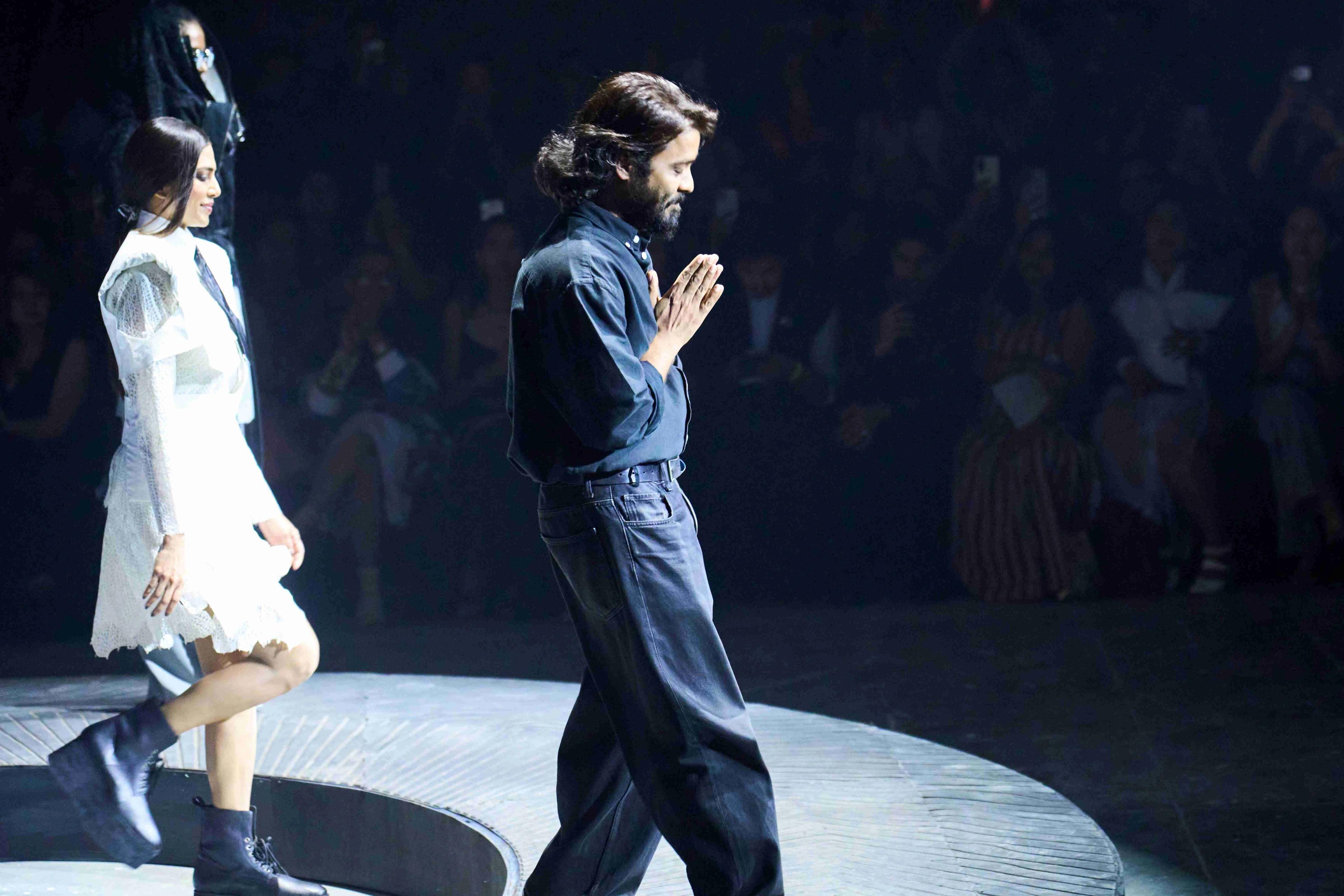 Showstopper Malavika Mohanan and Designer Anurag Gupta at LFW 2026, with the front row pictured behind.