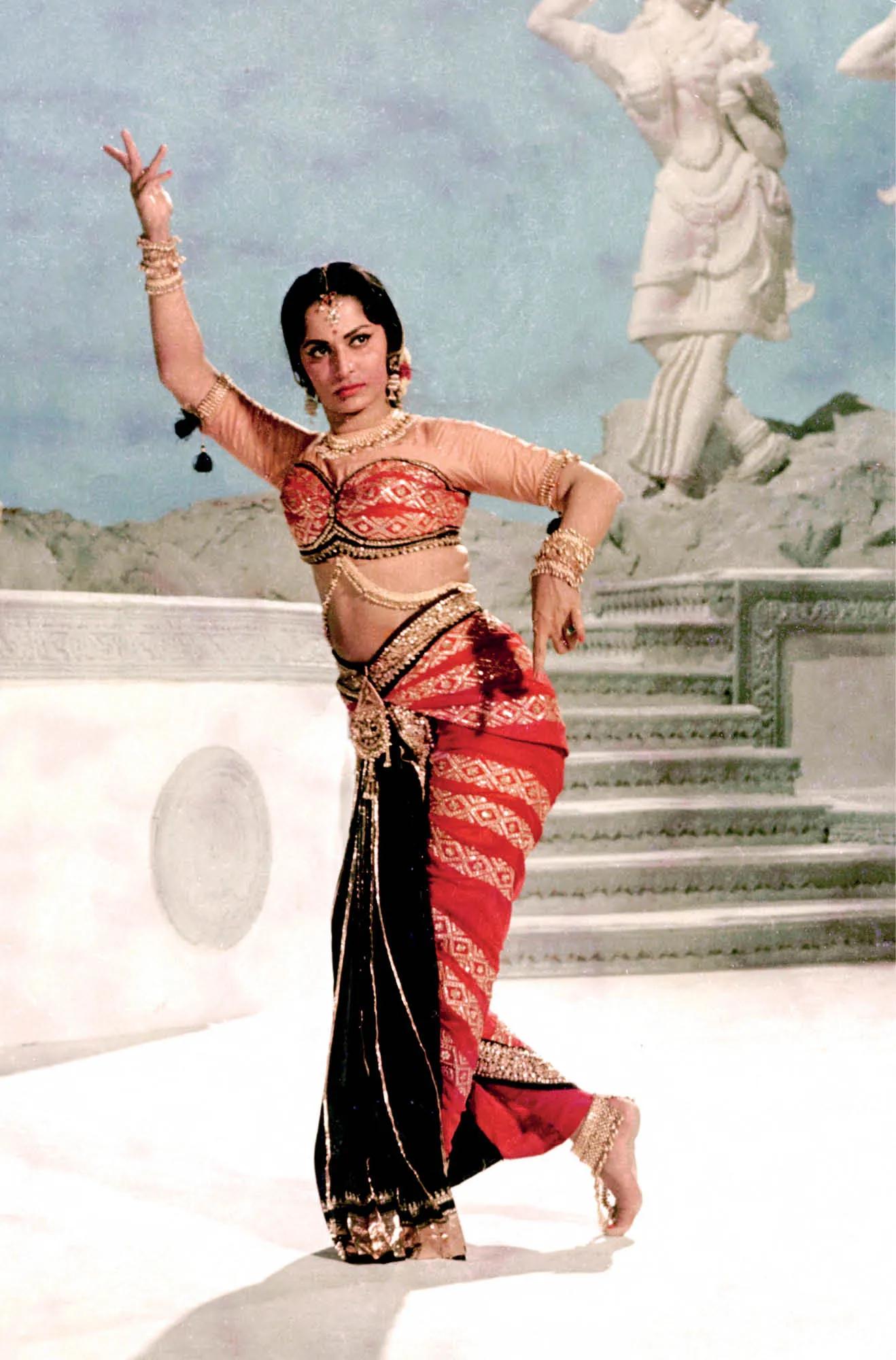 Waheeda Rehman dancing on the iconic sequence, "Piya Tose Naina Laage Re" in 'Guide', styled by Bhanu Athaiya.