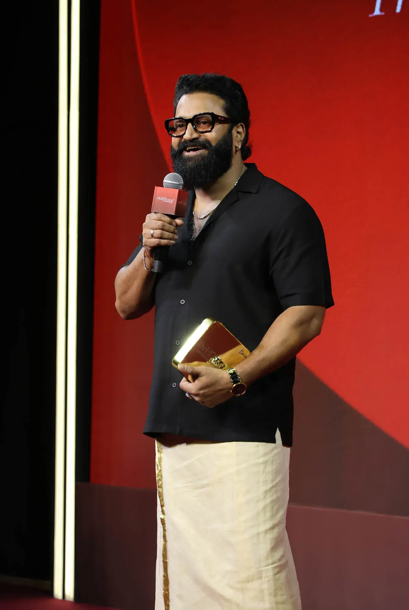 Rishab Shetty receiving the award for 'Kantara: Chapter 1'