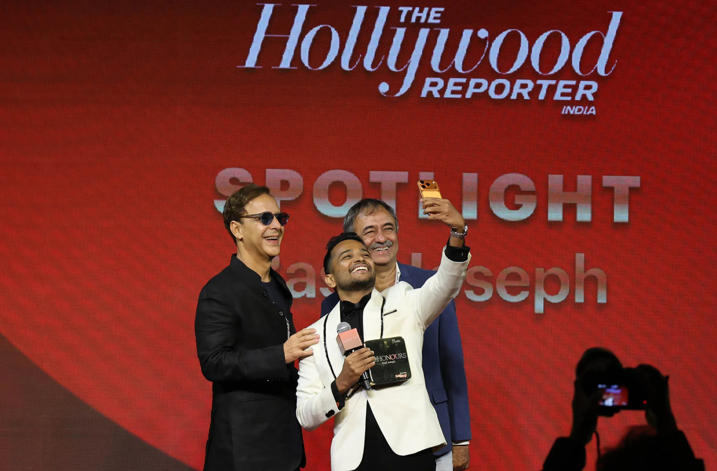 Basil Joseph, one of the honourees of the THR Spotlight award, couldn't resist a selfie moment with Vidhu Vinod Chopra and Rajkumar Hirani