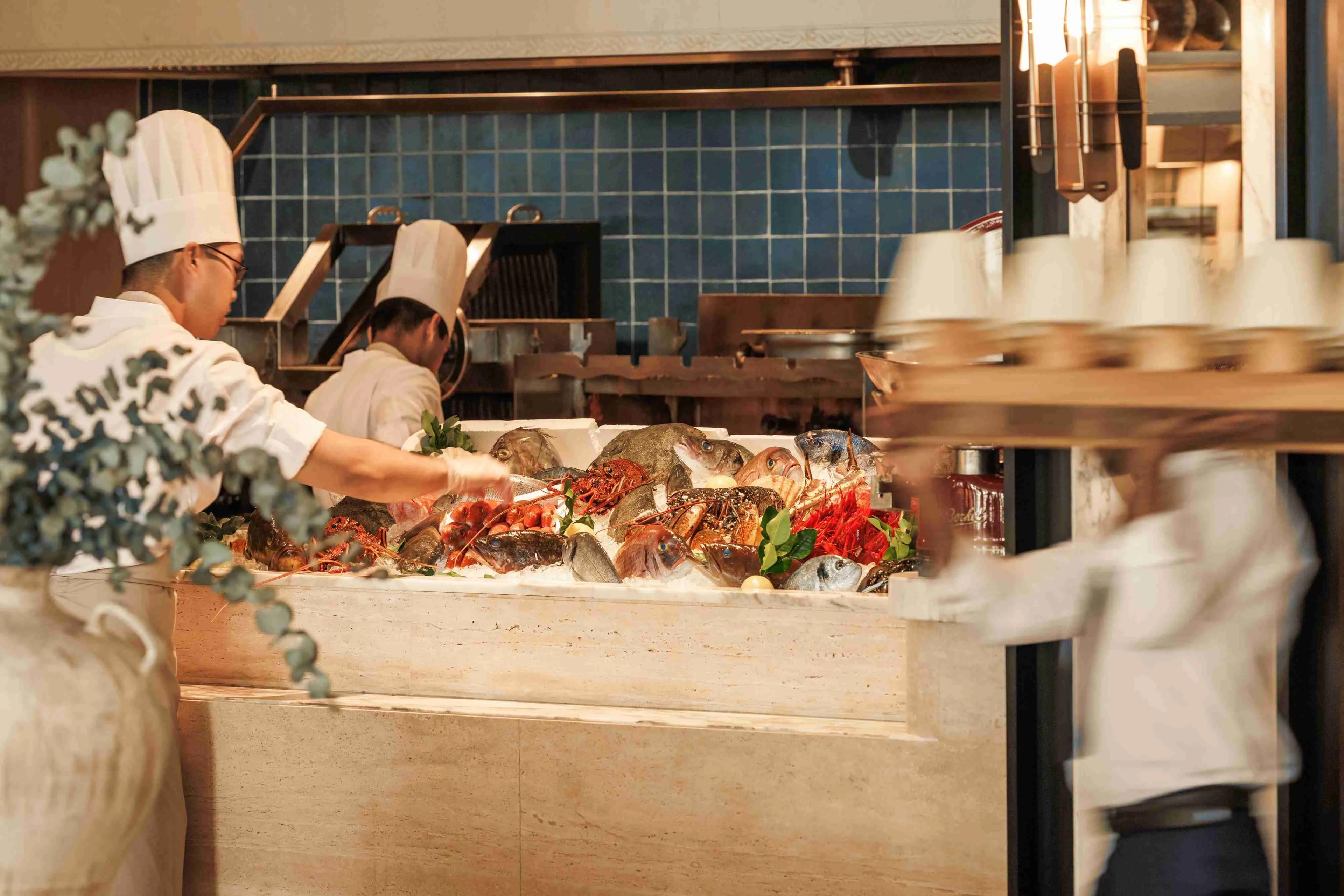 Seafood being prepared at Iliana.