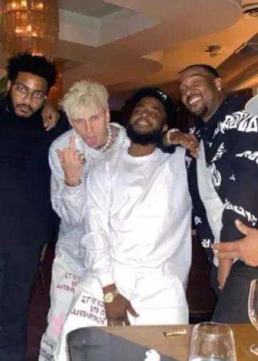 Machine Gun Kelly wearing Almost Gods.