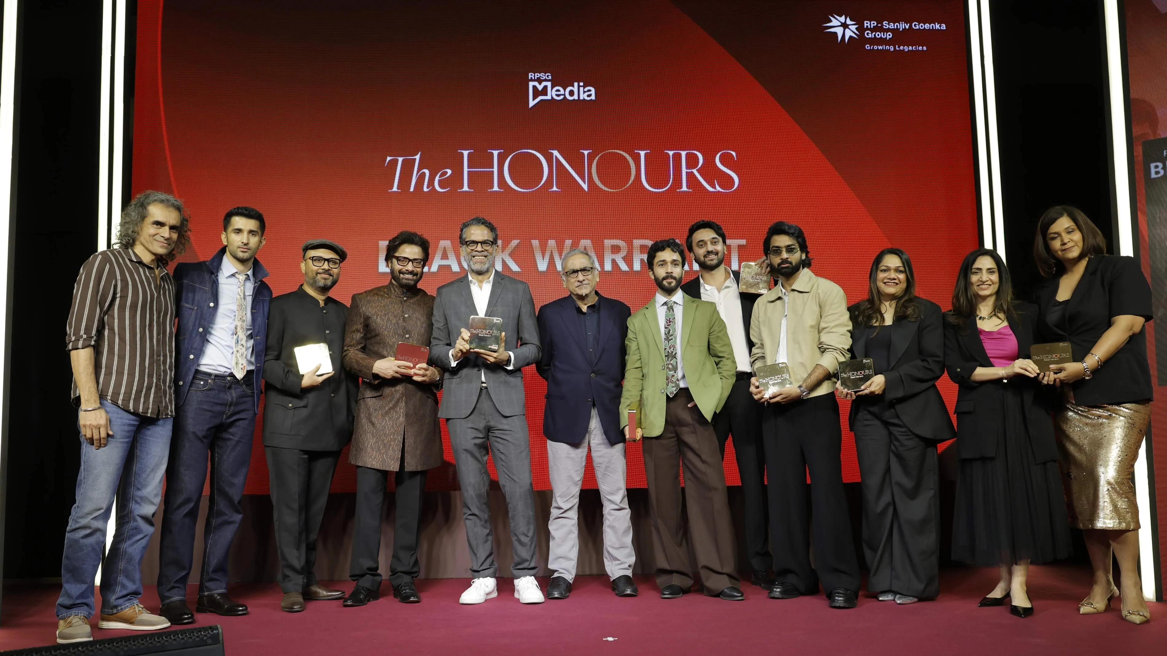 Imtiaz Ali presents The Honours award to team 'Black Warrant' on stage